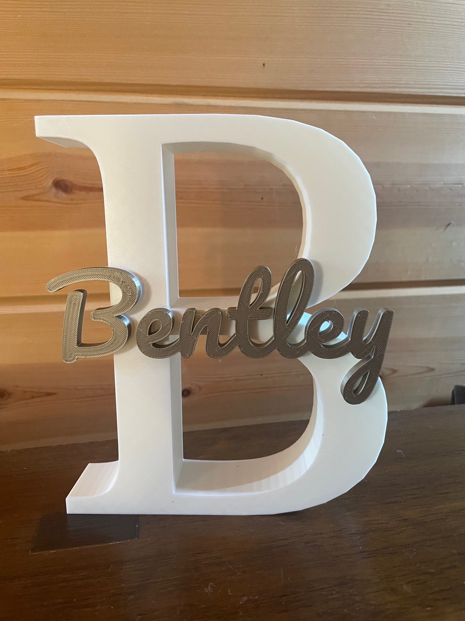 Large first initial and name printed on top